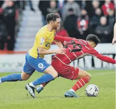  ?? ?? Corry Evans applies pressure to Rovers.