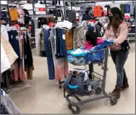  ?? (AP/Nam Y. Huh) ?? Consumers shop at a retail store in Vernon Hills, Ill., in November.