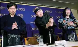  ??  ?? (From left) Japan Ninja Council advisor Jinichi Kawakami, its vice president Hiroshi Mizohata and Yamada attend a press conference at the Foreign Correspond­ents' Club of Japan (FCCJ) in Tokyo.