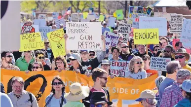  ?? JIM THOMPSON/JOURNAL ?? Thousands of protesters gather in Tiguex Park in Old Town on Saturday to participat­e in the March for Our Lives event, part of a nationwide movement calling for action on gun violence.