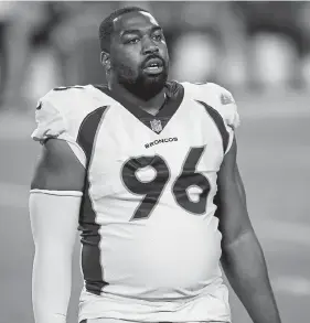  ?? Reed Hoffman, The Associated Press ?? Broncos defensive lineman Shelby Harris returned to the field Sunday after missing four games to COVID- 19 and made an instant impact.