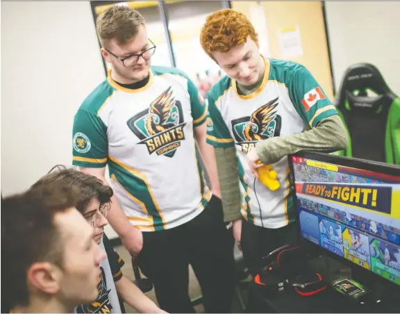  ?? DAX MELMER ?? Members of St. Clair College’s eSports education program — from left: Chris Kushman, 19, Joe Bumbacco, 20, Tyler Pouget, 18, and Ryan Baker, 19 — practise playing Super Smash Bros. Ultimate on campus Thursday. The college’s eSports program is preparing for its annual video game tournament, Saints Gaming Live, scheduled for May 11.