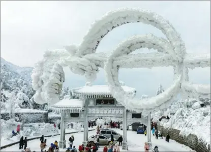  ?? MA GANG / FOR CHINA DAILY ?? Visitors enjoy a spectacula­r snow scene at Lushan Mountain, Jiujiang, Jiangxi province, on Feb 20 after heavy snowfall in the region. Lushan National Park is a major tourist site that attracts millions of visitors each year.