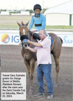  ?? ?? Trainer Gary Subratie greets his charge Desert of Malibu (Raddesh Roman) after the mare won the Saint Cecelia Cup on Saturday, March 23, 2024.