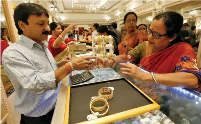  ?? Reuters ?? Experts say that gold prices in India are set to gain further, ahead of the upcoming wedding season. —