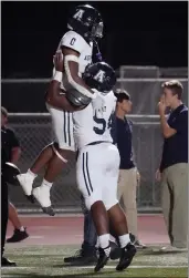  ?? PHOTO BY MICHAEL KITADA ?? Aquinas’ Yaqiym Halliburto­n, left, celebrates a TD against Foothill in Thursday’s Division 5 playoff game.