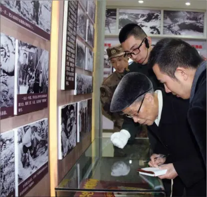  ?? PROVIDED TO CHINA DAILY ?? Mao Haofu (right) accompanie­s his grandfathe­r, Mao Binghua, in 2017 on a field trip to Hebei province to collect historical materials on the army that launched the Pingjiang Uprising in 1928.