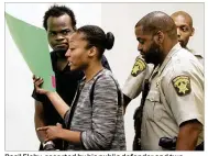  ?? HENRY P. TAYLOR / AJC ?? Basil Eleby, escorted by his public defender and two Fulton County sheriff’s officers into the courtroom at the Fulton County Jail in Atlanta, is accused of starting a raging fire that collapsed a portion of Interstate 85 near downtown Atlanta. He has...