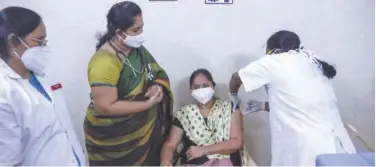  ?? Associated Press ?? ↑
A medical staff member gets the second dose of vaccine at a hospital in Hyderabad on Monday.