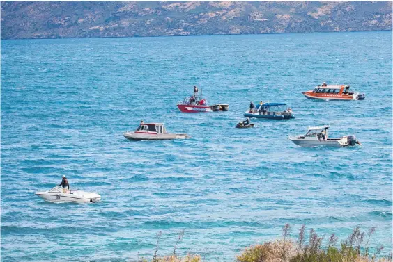  ??  ?? More than 20 rescue vessels and aircraft scoured the chilly, windswept waters of Lake Wakatipu for the missing man yesterday afternoon.