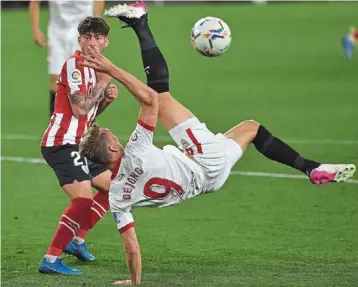  ?? —afP ?? acrobatic: sevilla’s luuk de Jong doing a bicycle kick during the la liga match against athletic Bilbao at the Ramon sanchez Pizjuan.