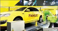  ?? ZHANG JINQIAO / FOR CHINA DAILY ?? Japanese robot maker Fanuc Corp’s product at a fair in Shanghai.