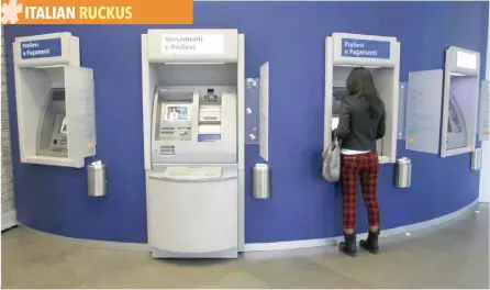  ?? — Reuters ?? A woman gets money at an ATM machine in Milan, Italy.