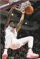  ?? LEE LUTHER JR. — THE ASSOCIATED PRESS ?? Virginia Tech’s Ahmad Hill dunks during Monday’s win over No. 10 North Carolina. Hill scored 18 points for the Hokies.