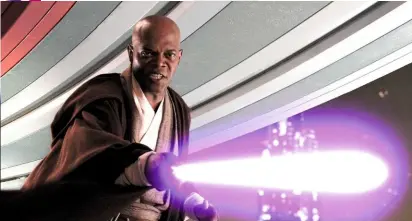  ??  ?? Below: Mace Windu in lightsaber action.Bottom: Jackson’s lightsaber hilt, etched with the letters BMF: “Bad Motherfuck­er”.