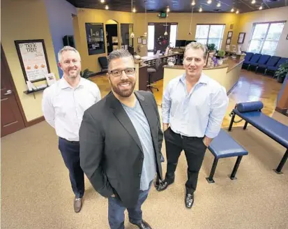  ?? JOE BURBANK/STAFF PHOTOGRAPH­ER ?? A group of chiropract­ors — doctors Bret Scheuplein, Marc Ott and Brent Baldasare — founded SafeCare Docs, an auto-injury referral service. “We’re saying that our first priority is not getting paid, but making sure that you’re well,” Ott said.