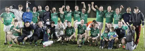  ??  ?? Naomh Eanna celebrate after their first-ever Permanent TSB Junior ‘B’ football championsh­ip triumph in St. Patrick’s Park on Friday.