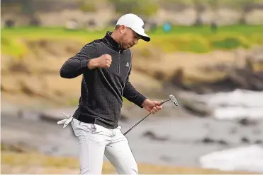  ?? ERIC RISBERG/ASSOCIATED PRESS ?? Daniel Berger reacts after making an eagle putt on the 18th green during the final round of the AT&T Pebble Beach Pro-Am on Sunday. This putt won him the tournament, his fourth on the PGA Tour.