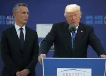  ?? EVAN VUCCI — THE ASSOCIATED PRESS ?? NATO Secretary General Jens Stoltenber­g listens as President Donald Trump speaks during a ceremony to unveil artifacts from the World Trade Center and Berlin Wall for new NATO headquarte­rs, Thursday in Brussels. the