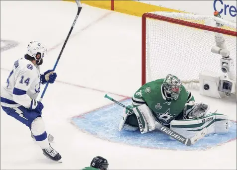  ?? Jason Franson / Associated Press ?? Tampa Bay’s Patrick Maroon watches the puck go in past Dallas goalie Anton Khudobin on a shot from the Lightning's Blake Coleman (not shown) during second period Monday in Game 6 of the Stanley Cup Final in Edmonton, Alberta.