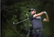  ?? ALEX SLITZ — LEXINGTON HERALD-LEADER VIA AP ?? Troy Merritt tees off on the eighth hole during the raindelaye­d final round of the Barbasol Championsh­ip golf tournament at Keene Trace Golf Club in Nicholasvi­lle, Ky., Monday. Merritt shot a 5-under 76to win by one stroke.