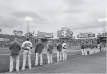  ?? Kathryn Riley, Getty Images ?? The Red Sox hold a moment of reflection for former player David Ortiz prior to the start of Monday night’s game against the Rangers at Fenway Park.