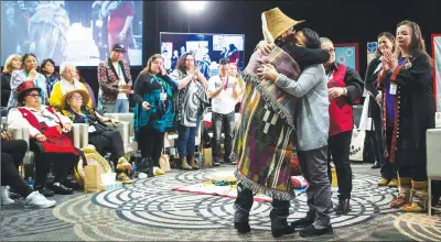  ?? CP PHOTO ?? Bernie Williams, front left, who has been an advocate for women in Vancouver’s Downtown Eastside for 30 years, receives a hug after testifying at the final day of hearings at the National Inquiry into Missing and Murdered Indigenous Women and Girls, in...