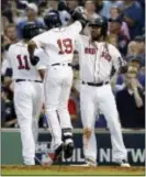  ?? THE ASSOCIATED PRESS ?? Red Sox’s Jackie Bradley Jr., (19) celebrates his three-run home run with Rafael Devers, left, and Hanley Ramirez, right, during the seventh inning of Game 3.