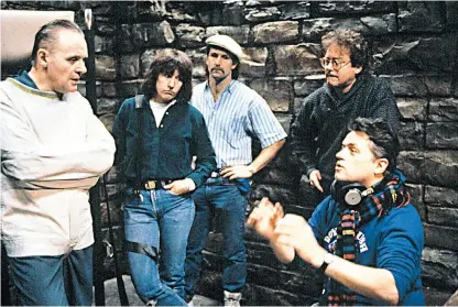  ??  ?? Demme, on the right, with Anthony Hopkins, left, and the crew on the set of The Silence of the Lambs in 1991