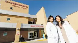  ?? LUIS SÁNCHEZ SATURNO ?? Biatris Barrera, left, and Rachel Goodman are shown at Presbyteri­an Española Hospital. The native New Mexicans, both new physicians who trained at the University of New Mexico, decided to start their careers in Española to help improve the care of...