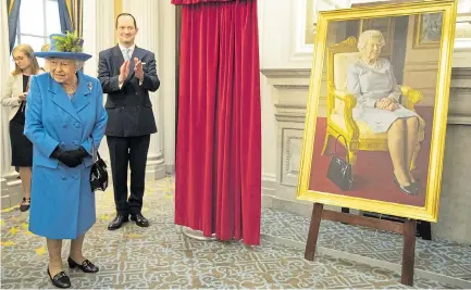  ??  ?? The Queen at the unveiling of the new portrait by artist Benjamin Sullivan at the RAF Club in London yesterday