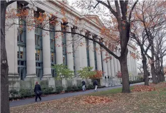  ??  ?? Students walk past Harvard Law School. Greece has a proportion­ately high number of academics at top US universiti­es.