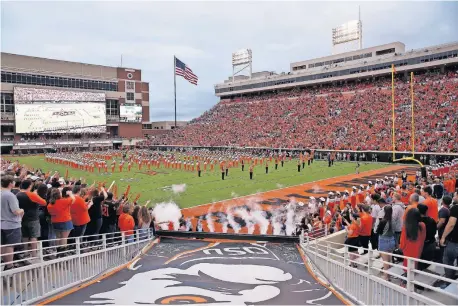  ?? [SARAH PHIPPS/THE OKLAHOMAN] ?? The OSU band plays before a 2018 game. Will the Cowboys have an opponent for their opener scheduled for Sept. 3?