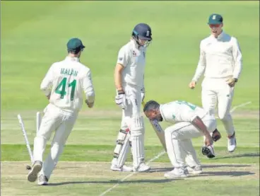  ?? REUTERS ?? South Africa's Kagiso Rabada celebrates taking the wicket of England skipper Joe Root (centre) at Port Elizabeth on Thursday.