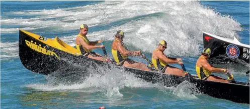  ?? PHOTO: STACY SQUIRES/FAIRFAX NZ ?? A surf boat braves the waves during racing at the national surf lifesaving championsh­ip at New Brighton beach.