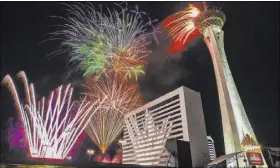  ?? Benjamin Hager Las Vegas Review-Journal @benjaminhp­hoto ?? Fourth of July fireworks fill the Las Vegas skyline in 2018.