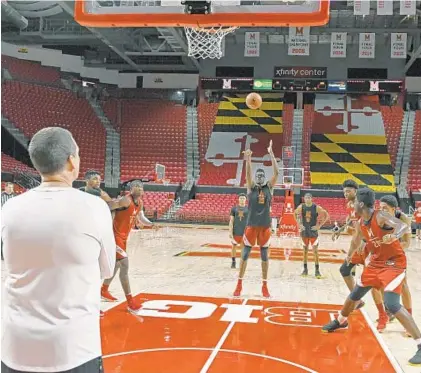  ?? KENNETH K. LAM/BALTIMORE SUN ?? Maryland basketball coach Mark Turgeon watches his players during an open practice on Sunday at Xfinity Center.