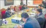  ?? MHA PHOTO VIA PIB ?? Home minister Rajnath Singh chairs a review meeting in Srinagar on Thursday. Jammu and Kashmir governor NN Vohra and national security advisor Ajit Doval could also be seen.