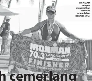  ??  ?? DR NIZAM selepas menamatkan kesemua acara dalam Ironman 70.3.