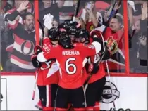  ?? SEAN KILPATRICK, THE CANADIAN PRESS ?? Ottawa Senators’ Mike Hoffman, Kyle Turris, Fredrik Claesson , Alex Burrows and Chris Wideman celebrate Hoffman’s goal. Ottawa won, 5-1.