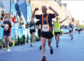  ??  ?? Michael Knight crosses the finish line in the 2019 KBC Dublin Marathon.