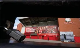  ??  ?? A locked gate outside the Kop at at Anfield. Photograph: Christophe­r Thomond/The Guardian