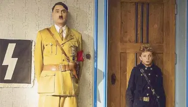  ??  ?? Taika Waititi and Roman Griffin Davis in Jojo Rabbit, now showing.