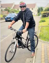  ??  ?? On loan Siju Thomas, assistant practition­er at Hairmyres Hospital with his bike