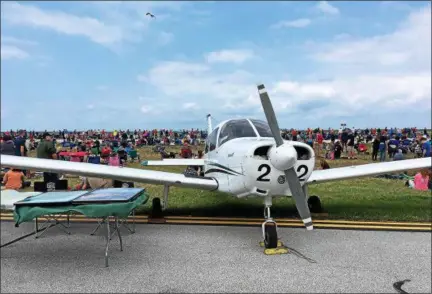  ?? TRACEY READ — THE NEWS-HERALD ?? A crowd waits to watch the U.S. Army Golden Knights parachute team Sept. 3 during the second day of the Cleveland National Air Show. The show continues Labor Day at Burke Lakefront Airport.