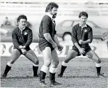  ??  ?? Left, Bill Bush leads the haka for NZ Ma¯ori in 1982; right, he watches as Tane Norton battles for the loose ball during an All Blacks test against Australia in the wet in 1974.