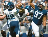  ?? BARRY REEGER/AP ?? Penn State defensive tackle PJ Mustipher, 97, has played five seasons for the Nittany Lions. Here he pressures Villanova quarterbac­k Daniel Smith during a game in 2021.