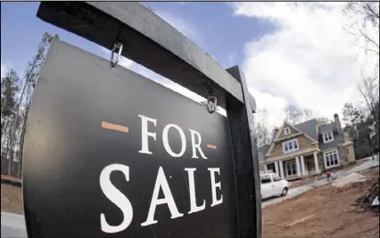  ?? JOHN BAZEMORE / AP FILE ?? U.S. home prices rose in December 2016 from a year earlier at the fastest pace in 11 months, as buyers bid for a limited supply of available property, according to a 20-city home price index.