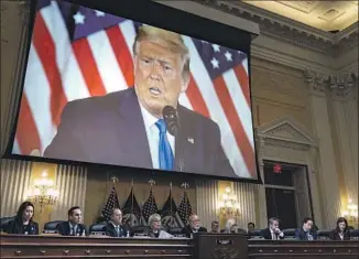  ?? Kent Nishimura Los Angeles Times ?? AN IMAGE of former President Trump is displayed during Monday’s final public meeting of the House Jan. 6 committee. Rep. Adam B. Schiff (D-Burbank) is third from left.