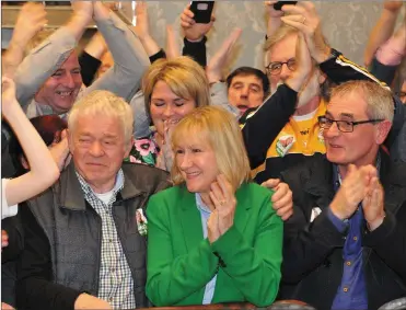  ??  ?? Imelda Munster is congratula­ted by her mentor Hugh McShane after she elected on the first count.